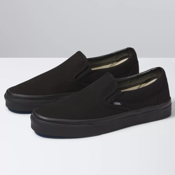 solid black vans slip on